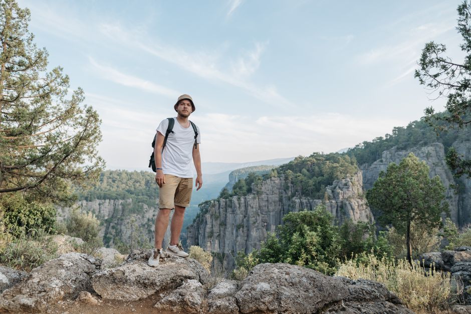 Explore breathtaking mountain views with a solo adventurer in rugged wilderness landscape.